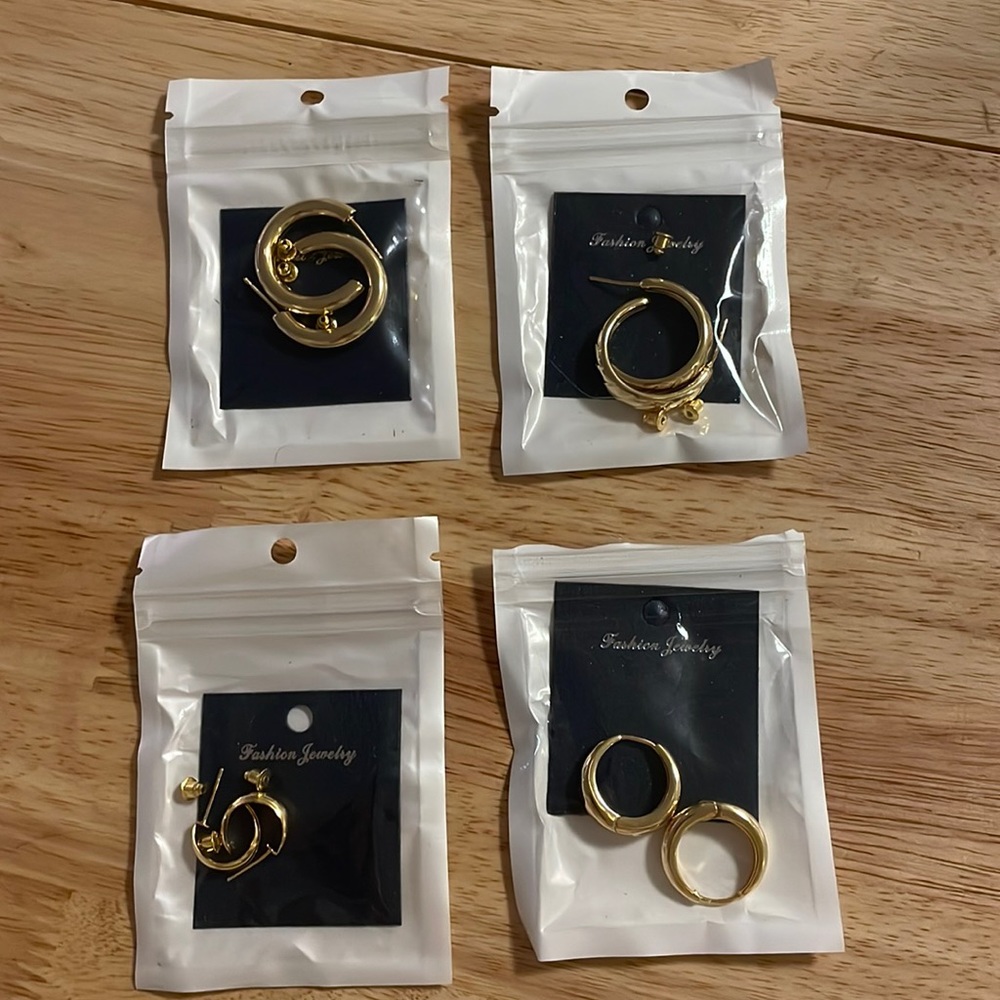 Four pairs of multi-size gold hoops